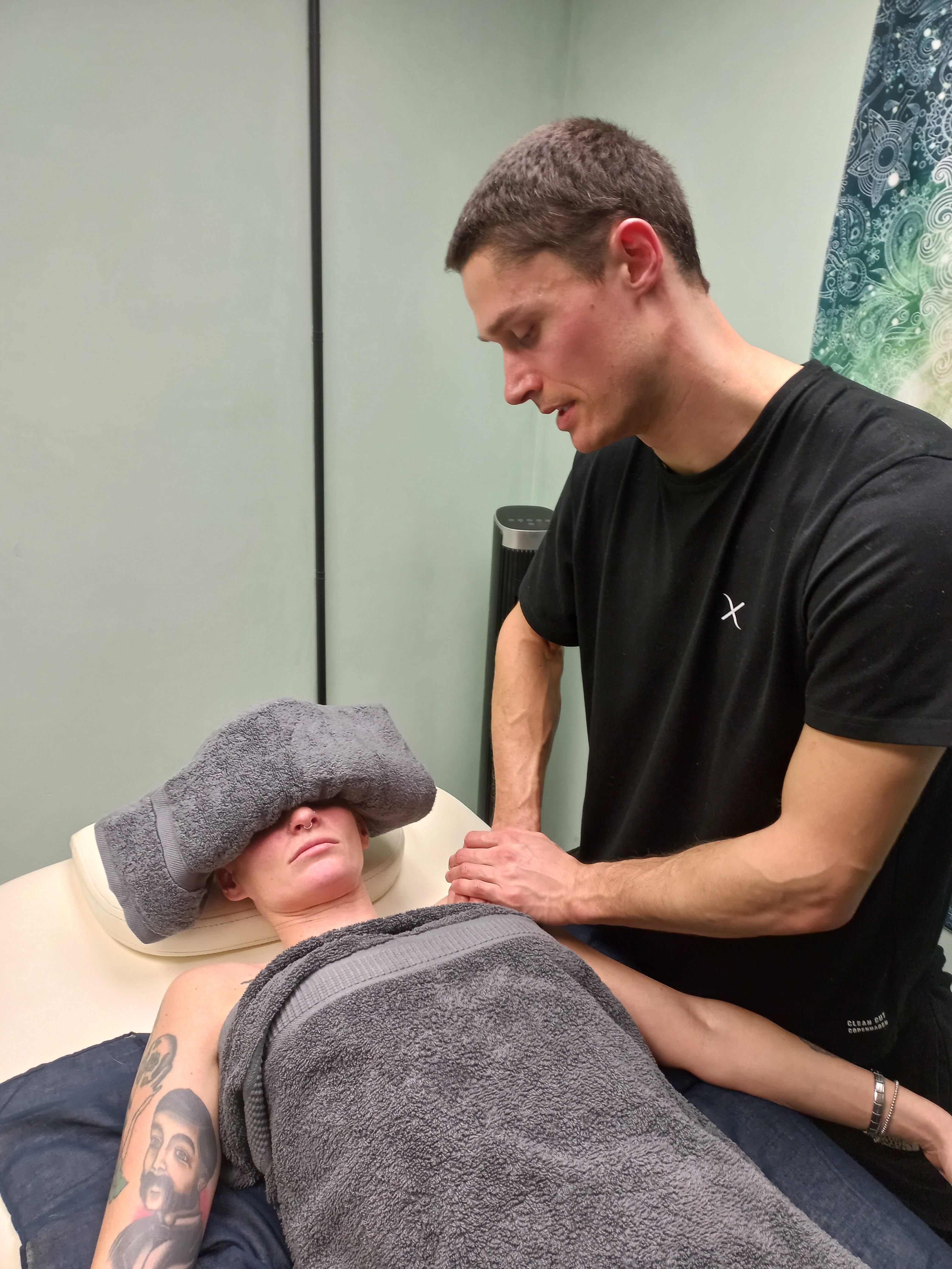Jake Richardson providing deep tissue sports massage therapy for back pain relief and rehabilitation in Worcester